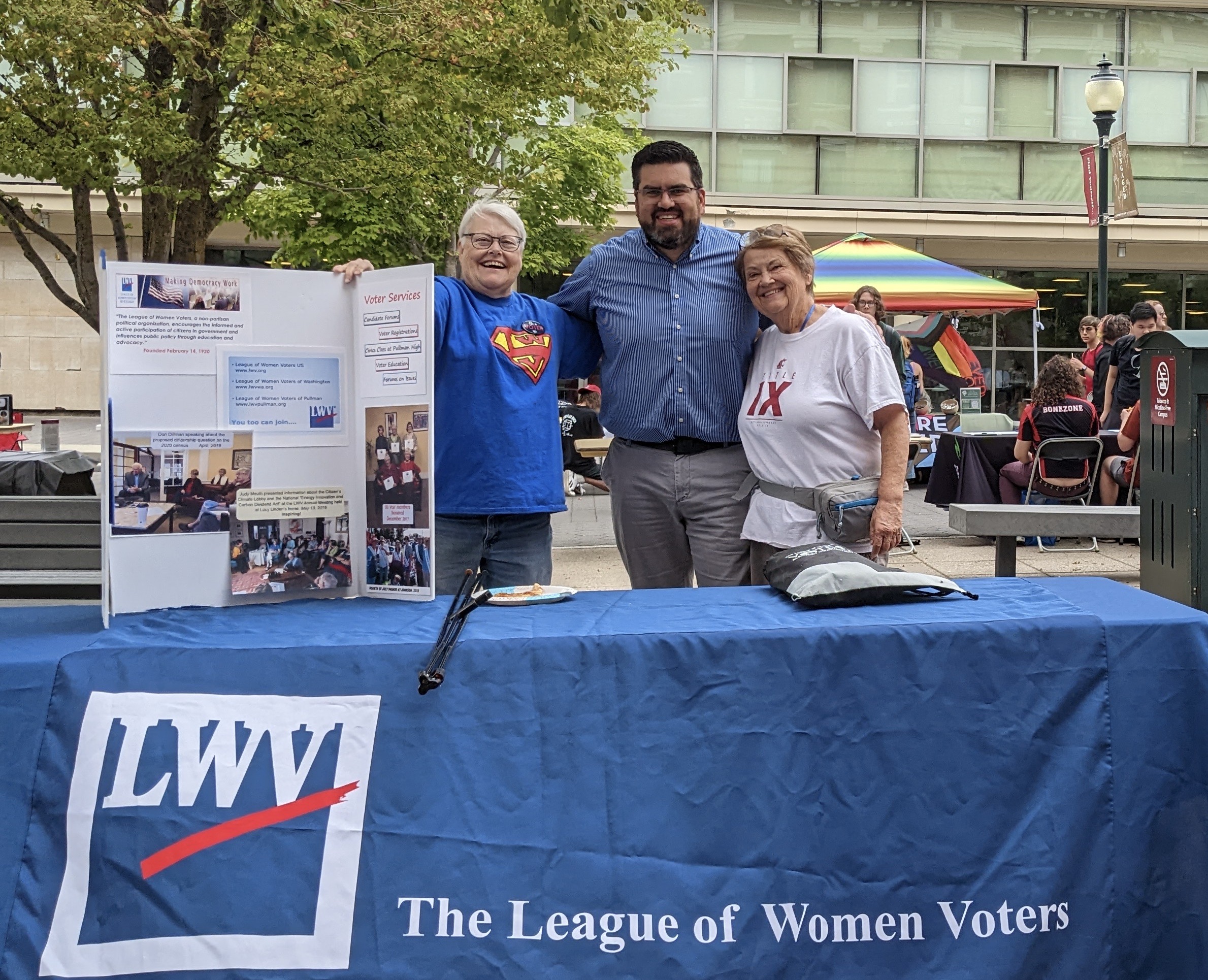 Image of voter registration signup table on WSU campus with Deb Olsen, Brandon Chapman and Sue Hinz.